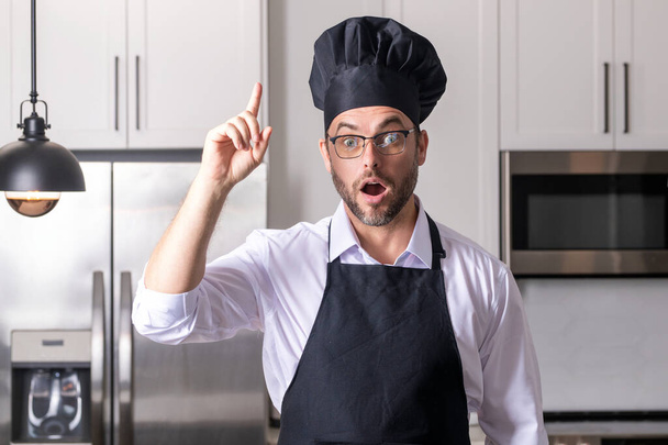 Cooking and culinary concept. Chef cook in uniform on kitchen. Male chef or cook baker man in apron cooking. Portrait of chef cook in beret. Cooking food concept - Foto, Bild