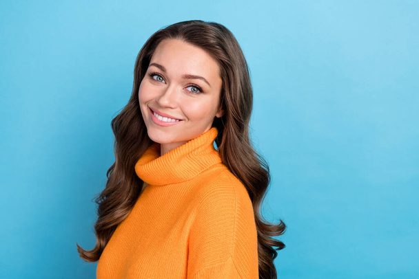 Photo of pretty girly lady wear knitted pullover smiling empty space isolated blue color background. - Φωτογραφία, εικόνα