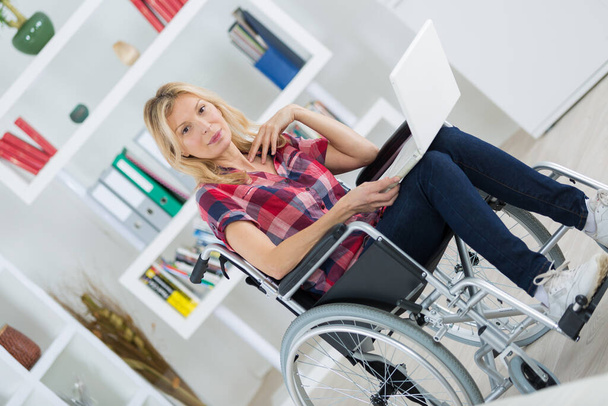 female web surfing in wheelchair - Valokuva, kuva