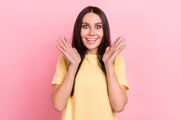 Photo of excited funny lady raise arms air hear amazing news glad delighted wear yellow shirt isolated pink color background. - Foto, afbeelding