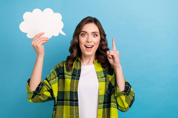 Photo of excited funky lady wear checkered jacket pointing finger mind cloud empty space isolated blue color background. - Photo, Image