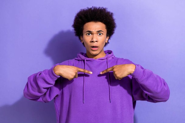 Photo of impressed questioned young man point fingers self himself cant believe isolated on violet color background. - Foto, afbeelding