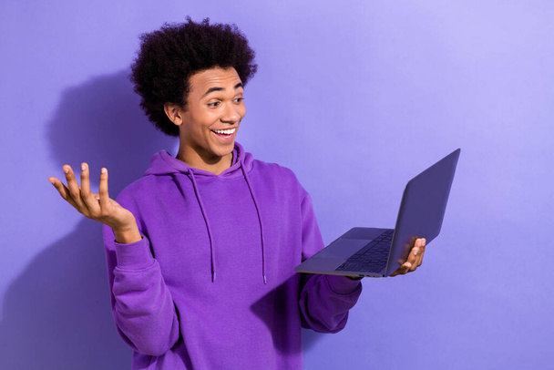 Photo of funky cheerful man speak communicate networking video call wireless netbook isolated on violet color background. - Φωτογραφία, εικόνα