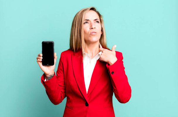pretty blonde woman feeling stressed, anxious, tired and frustrated. businesswoman and a phone concept - 写真・画像