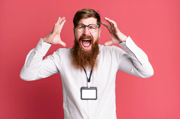 long beard man screaming with hands up in the air. vip badge accreditation concept - Fotoğraf, Görsel