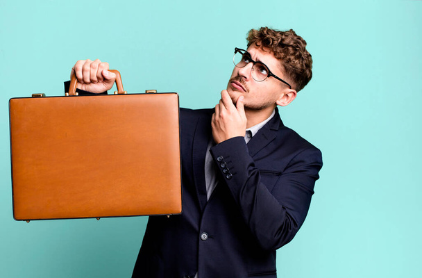 young adult caucasian businessman with a suit case - Фото, зображення
