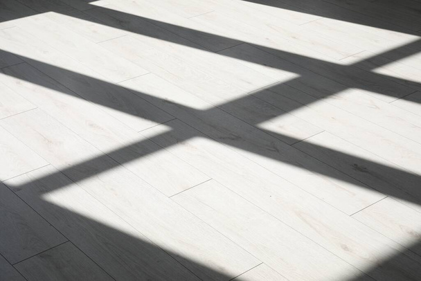 Shadow from window on white laminated floor - Fotoğraf, Görsel