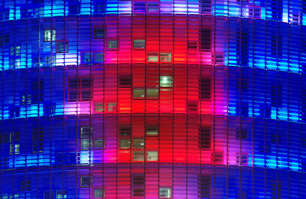 modern office building at night illuminated in colors - Photo, Image