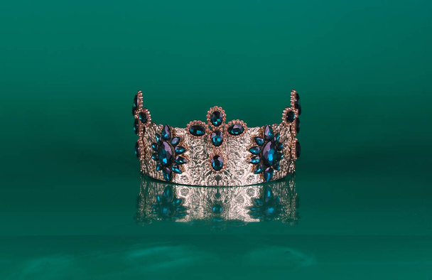 crown with diamonds isolated on green background - Fotoğraf, Görsel