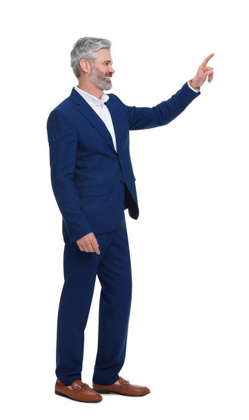 Mature businessman in stylish clothes posing on white background - Zdjęcie, obraz
