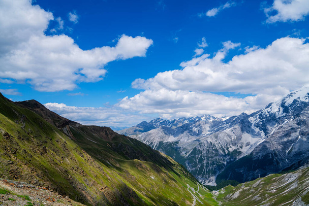 View from the Stelvio Pass, the highest automobile pass in Italy, located between Trentino-Alto Adige and Lombardy, Italy. Ecologia and photo tourism concept. - 写真・画像