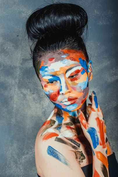 Asian woman with faceart face art - Foto, afbeelding
