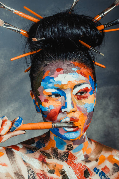Asian woman with faceart face art - Foto, afbeelding