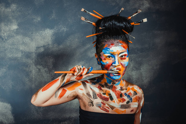 Asian woman with faceart face art - 写真・画像