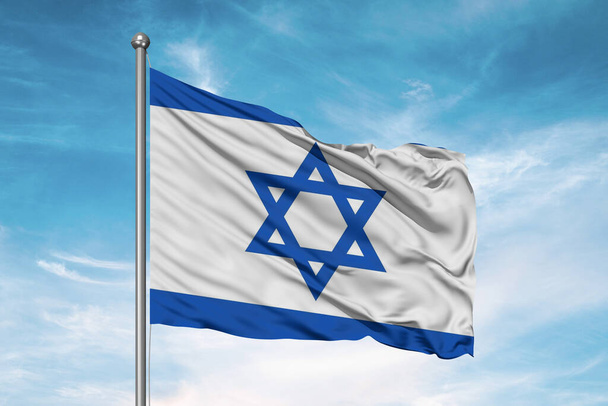 Israel national flag cloth fabric waving on beautiful cloudy Background. - Foto, afbeelding