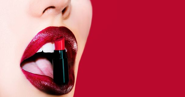 Sexy plump full lips. Lip care and protection. Lips isolated on red background. Lips and beauty make up - 写真・画像