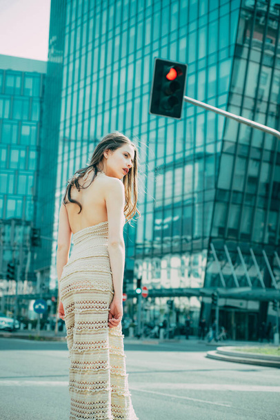 City life. Woman in modern town. Fashion street style vogue. Fashionable girl walking on streets - Fotó, kép