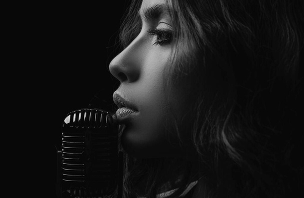Closeup woman with retro microphone. Karaoke girl singer. Concert, sing - Zdjęcie, obraz