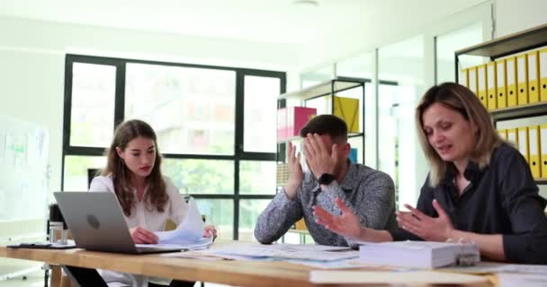 Frustrated frustrated people from business team are studying negative business statistics. Sad people due to poor performance frustrated by corporate bankruptcy crisis - Footage, Video
