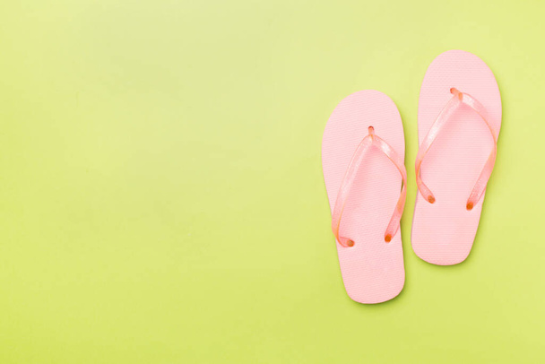Bright flip flops on color background, top view - Photo, image