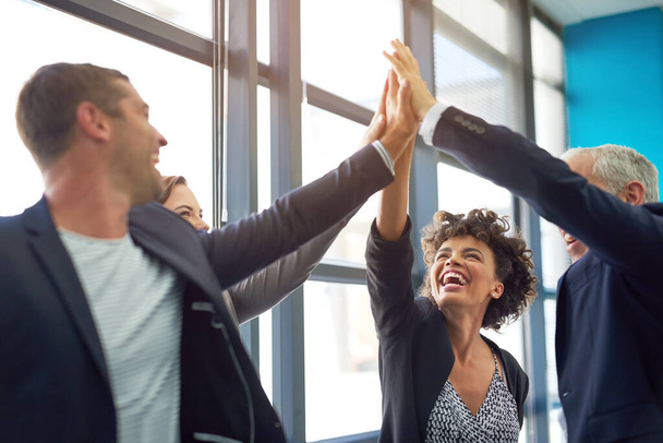 Business people, group high five and celebration in office with team, smile and support for company goals. Men, women and hands in air for teamwork, achievement and motivation at insurance agency. - Fotoğraf, Görsel