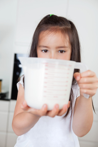 Girl with measuring Cup - Photo, Image