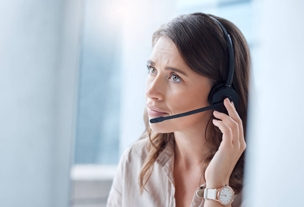 Worry, call center and woman with telemarketing, customer service and stressed in a workplace. Female person, employee or agent with headphones, tech support and help desk with advice or mistake. - Fotografie, Obrázek