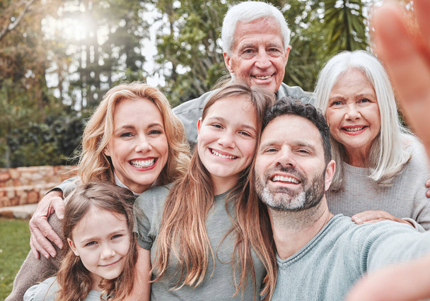 Big family selfie, smile and portrait in park with happiness, love and bond for social media, app or internet post. Father, mother and daughter with grandparents, profile picture or backyard garden. - Фото, изображение