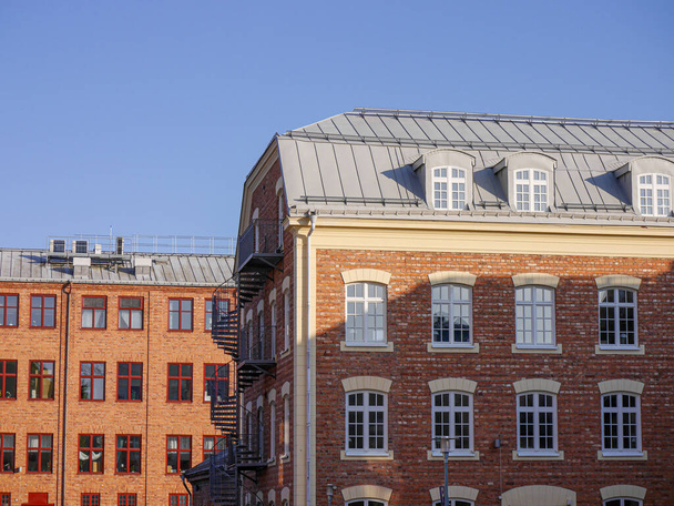 Low angle view of buildings against sky  - Фото, зображення