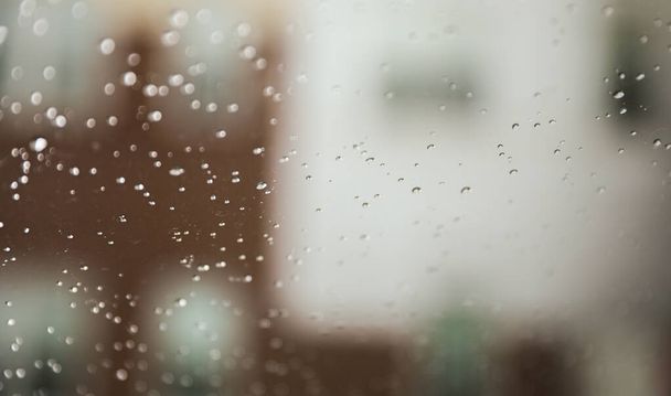 Rain drops on window symbolize serenity, tranquility, introspection, renewal, and the beauty of nature's elements - Φωτογραφία, εικόνα