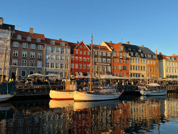 Touristic Nyhavn at sunset with colorful houses and boats - Photo, Image