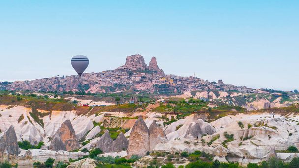 Cappadocia. Hot air balloons flying over Cappadocia in a dramatic sky. Travel to Turkey. Selective focus included - Foto, afbeelding