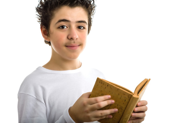 Cute boy reads brown cork blank book smiling - Fotó, kép