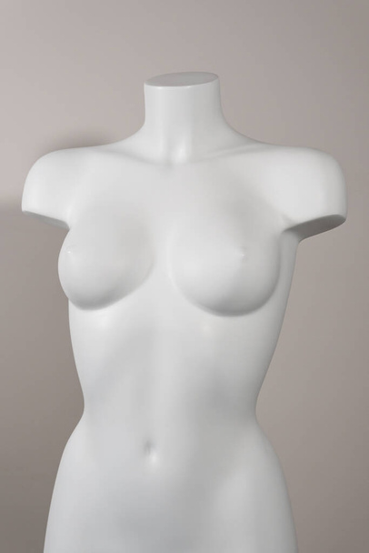 White mannequin or dressmakers dummy on light background, close-up. Concept of sewing workshop - Fotoğraf, Görsel