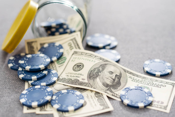 Blue poker chips on stock market chart background. High quality photo - Фото, изображение