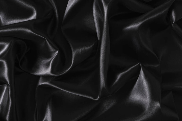Silk fabric, abstract wavy black satin fabric background - Fotó, kép