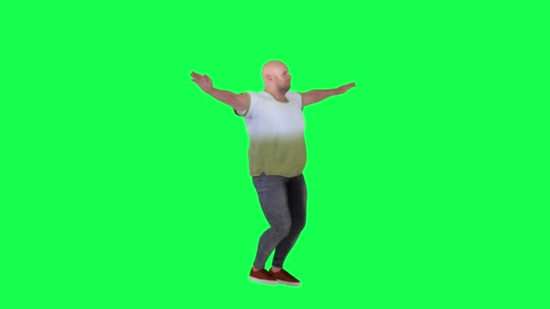 Bald young man stomping from left view on green screen - Footage, Video