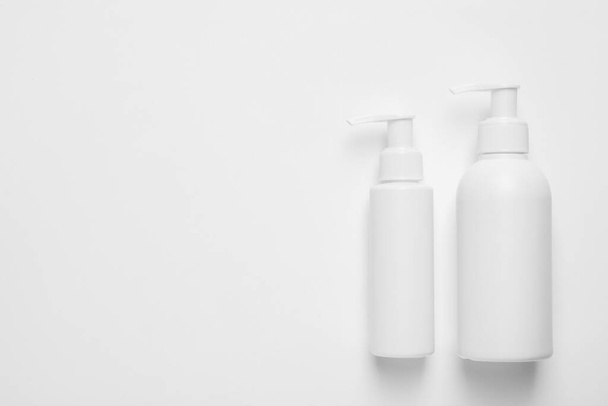 Different cleansers on white background, flat lay with space for text. Cosmetic product - Photo, Image