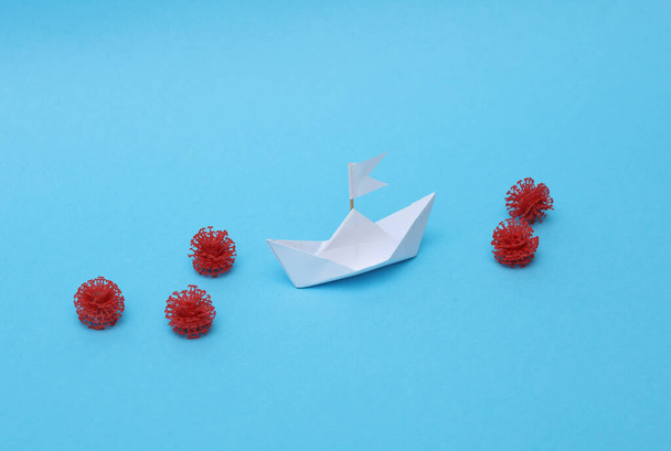 White paper boat with virus molecules on a blue background - Photo, Image