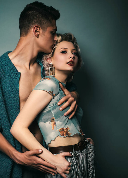 Hipsters love. Rock style. Fashion studio photo of beautiful sensual couple posing together.Love. Handsome young lovers - Foto, imagen