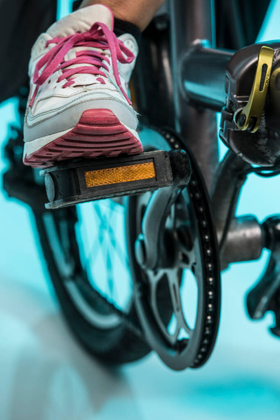 close - up of a woman in the gym with a bike  - Photo, Image