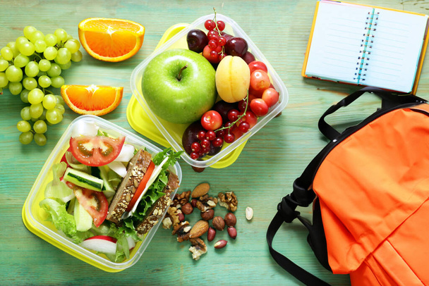 healthy food school lunch box with fruits vegetables and sandwich - Photo, Image