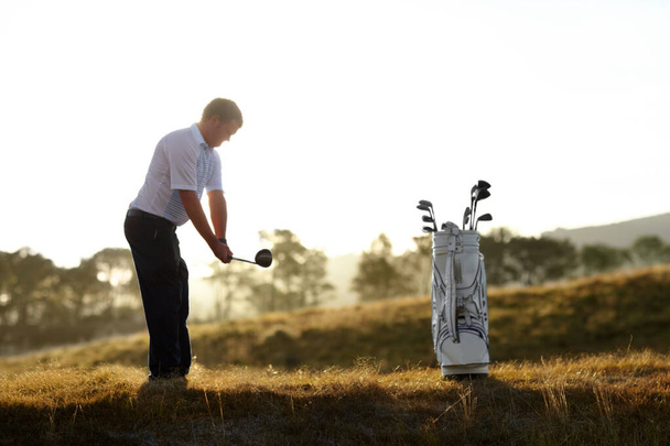 Golf, stroke and man with driver outdoor on course for training, workout or fitness at sunset mockup space. Golfing, club and person swinging for game, competition or exercise, sports and wellness - Photo, Image