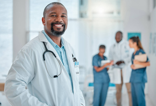 Happy, doctor and portrait of black man in hospital for medical help, insurance and trust. Healthcare, clinic team and face of professional male health worker smile for service, consulting and care. - Foto, Bild
