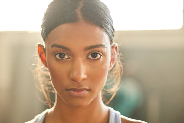 Fitness, portrait or Indian woman at gym for a workout, exercise or training for health or wellness. Face of sports girl or serious female athlete with strong mindset, resilience or focus in studio. - Foto, imagen