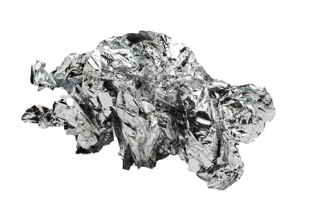 Crumpled aluminum foil isolated on white background. - Zdjęcie, obraz
