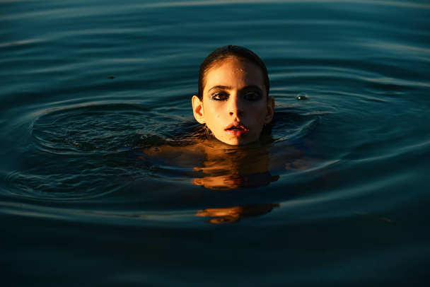 Sexy woman posing in water. Summertime. Sensual girl summer portrait. Beauty female - Fotoğraf, Görsel