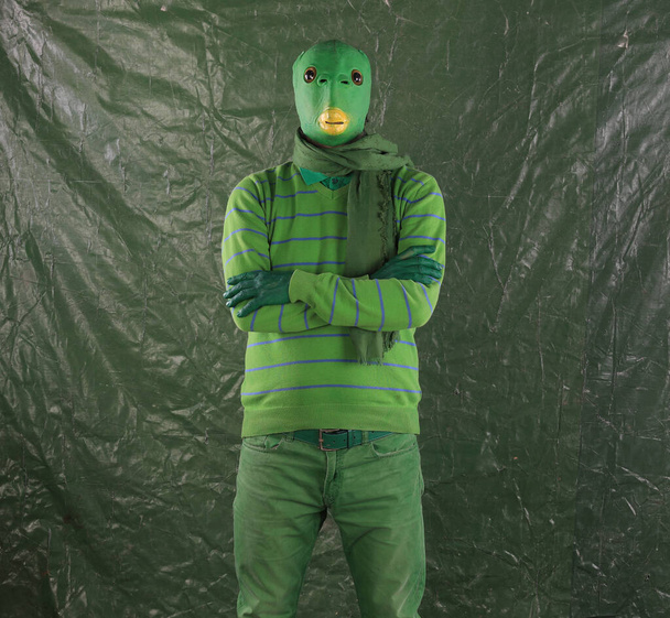 green alien on a green background - Foto, imagen