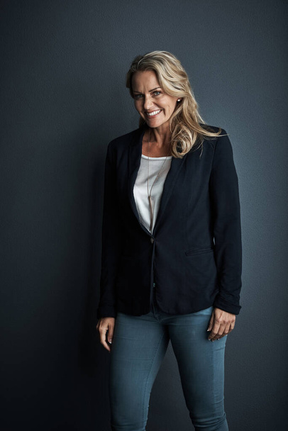 Here to realize all my corporate goals. Studio portrait of a mature businesswoman posing against a grey background - Photo, Image