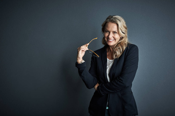 Ive committed myself to success right from the beginning. Studio portrait of a mature businesswoman posing against a grey background - Zdjęcie, obraz